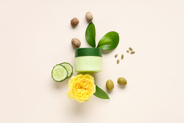Jar with natural cosmetic product and ingredients on white background