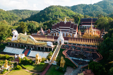 Top view of outdoor large Buddhist reclining Buddha at Wat Phra That Suthon Mongkhon Khiri...