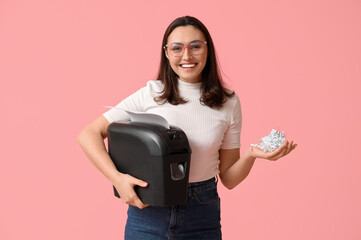 Secretary with shredder on pink background