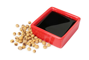 Tasty soy sauce in bowl and soybeans isolated on white