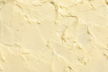 Texture of fresh natural butter as background, top view
