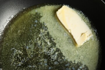 Melting butter in frying pan, top view