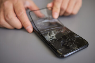 replacing broken glass with a new one. Broken smartphone display. Broken glass phone. Smartphone...