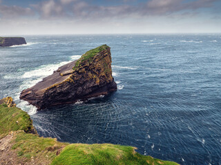 Kilkee cliff in county Clare, Ireland. Popular travel area with stunning nature scenery with green...