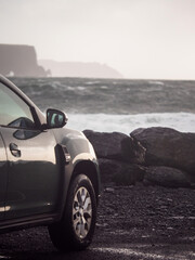 Car parked close to the ocean with view on amazing nature scene with powerful waves. Doolin area,...