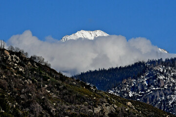 Cloud obscured Mount Eisen is a 12,185-foot-elevation double summit mountain located on the Great Western Divide of the Sierra Nevada Mountain Range, Tulare County, California 