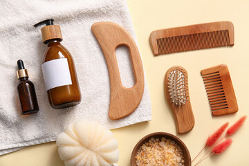 Beautiful spa composition with guasha body scraper on beige background
