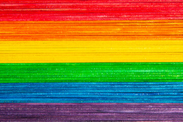 Rainbow flag with colorful popsicle sticks. Gay flag background. Pride month.