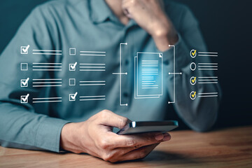management, marketing, strategy, information, social, corporate, smartphone, network, system, innovation. A man is holding a cell phone and looking at a screen with a lot of check boxes.