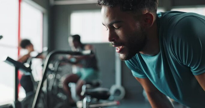 Gym, tired and man with exercise, breathing and training with wellness and endurance with workout. Fatigue, fitness and health center with guy and exhausted with challenge and bodybuilder with cardio