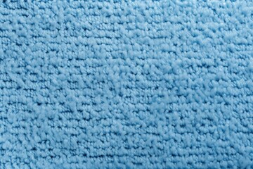 Sky blue close-up of monochrome carpet texture background from above. Texture tight weave carpet blank empty pattern with copy space for product 