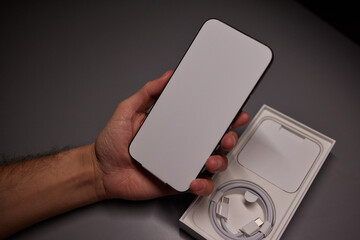 A white sticker protecting the smartphone screen