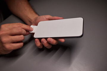 A white sticker protecting the smartphone screen