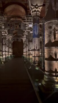 ISTANBUL, TURKEY-AUGUST 27, 2023: Theodosius Cistern. A colorful light show inside a cistern on columns in a dark hall. A lot of columns, semi-darkness with illumination. A large underground reservoir