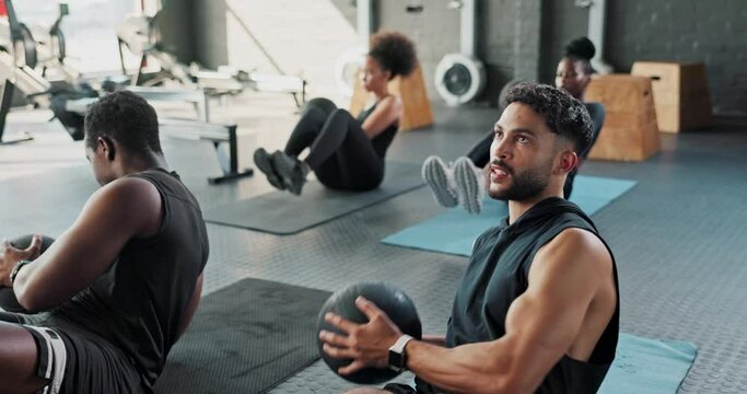 Ball, core or men in gym training abs for six pack muscles or strong stomach on mat in an exercise class. Balance, people or healthy athletes in calisthenics for body strength, abdomen or workout