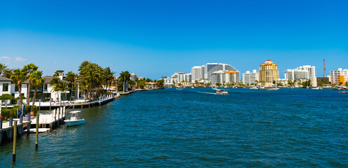 Obraz premium Summer vacation in tropical residential house. Luxury summer villa with yacht pier. Vacation in summer paradise. Luxury house apartment at summertime. Travel to bay at Florida neighborhood. Panorama