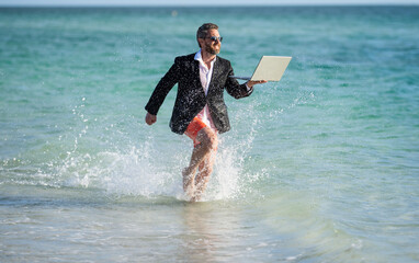 Businessman director running at the beach. director is very ambitious and carefree businessman....