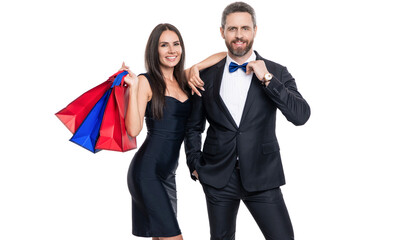 Couple holding shopping bags isolated white. Couple with shopper bags in mall. Purchasing present together. Two man and woman in shop mall. Big sale and shopping with couple