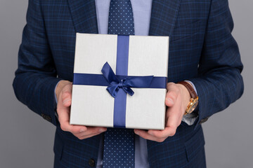 Successful man share gift box. Businessman prepare for romance date. Business reward. Business man...