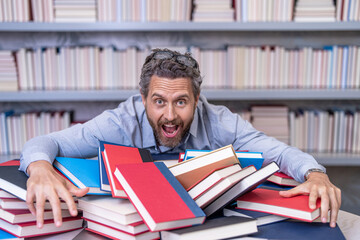 man teacher at the bookstore. college tutor reading books. back to school. school teacher in library. book lover man gets educated. knowledge day. teacher get knowledge from books. Sharing knowledge