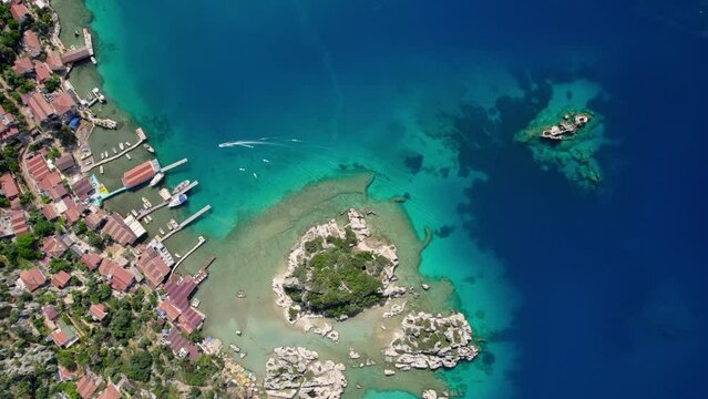 antalya kekova kalekoy castle aerial drone video turquoise blue sea cloudy sky settlement port and peninsula