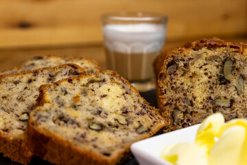 Sliced Banana Bread with Butter and Milk Coffee