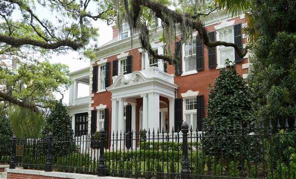 Savannah GA A Stately elegant home in the Historic District  shaded by Live oak trees and lush greenery