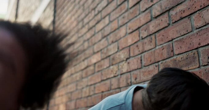 City, punch and men in street fight with violence, battle and disagreement in aggression, hit and conflict. Argument, bullying and angry friends in jealous brawl in urban alley with frustrated danger