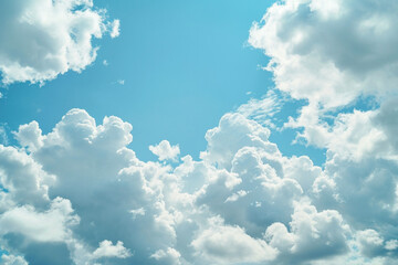 Beautiful fluffy clouds in a clear blue sky background on a sunny day, perfect for nature and weather concepts