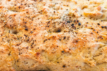 homemade flat bread with herbs and pepper topping