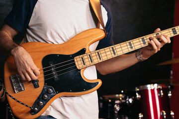 Fototapeta na wymiar Close-up of a musician playing bass