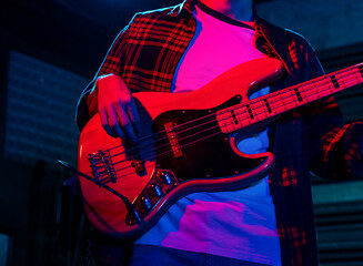 Young Musician Playing The Bass In A Live Concert