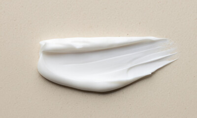 sample of cosmetic cream on light background