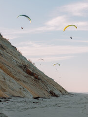 Paragliders over White Crest Beach in Cape Cod