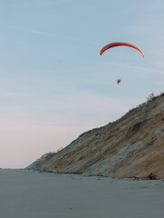Fototapeta na wymiar Paraglider over White Crest Beach