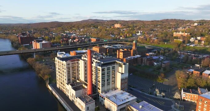 Late afternoon spring aerial video of downtown Troy, NY located on the Hudson River.