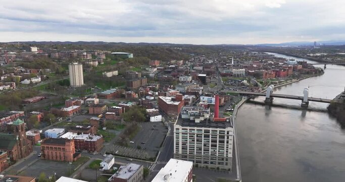 Late afternoon spring aerial video of downtown Troy, NY located on the Hudson River.