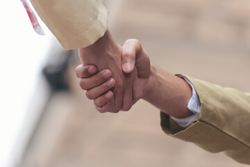 Arab Businessman shaking hands together. Teamwork business partner wear Muslim dress Shake Hands...