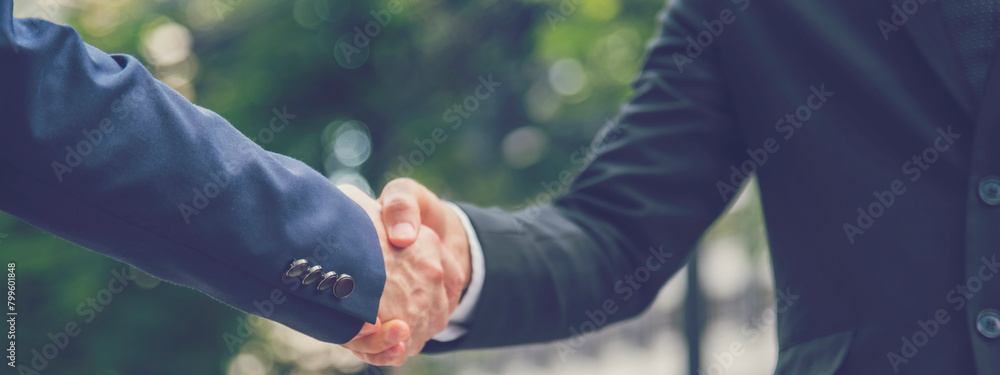 Wall mural Banner Lawyer teamwork partnership Businessman handshake together. Panorama Two Men Trust honesty lawfirm business handshake promise respect partner. Diversity solidarity team Partner hands together