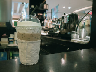 Iced coffee on table in cafe