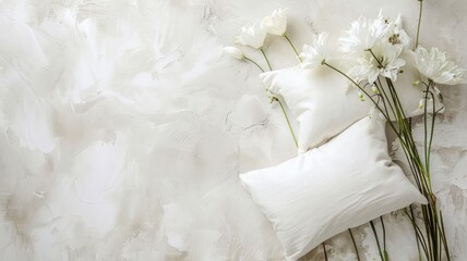 White pillows and daisies on textured cream background - obrazy, fototapety, plakaty