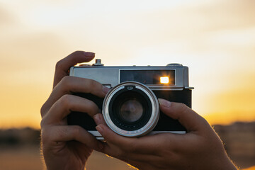 Taking Photos With Analog Camera At Sunset