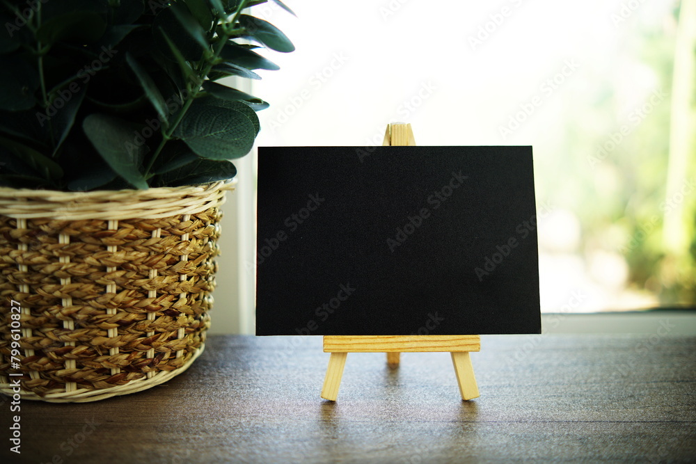 Poster Empty card space for text message with wooden easel