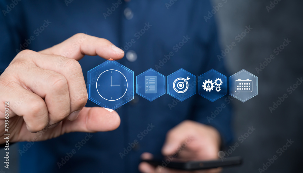 Aufkleber time management concept. businessman using smartphone with time management icon on virtual screen.