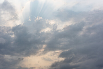 Outside the clouds outside the window, the sun emits sunlight, which is scattered through the...