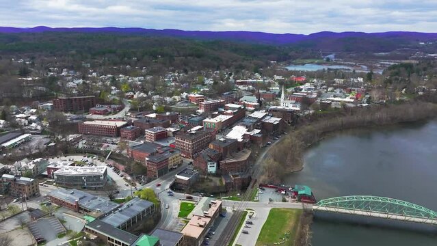 Late afternoon spring aerial video of an intersection in Brattleboro, VT.	
