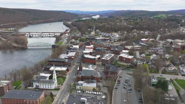 Late afternoon spring aerial video of an intersection in Brattleboro, VT.	