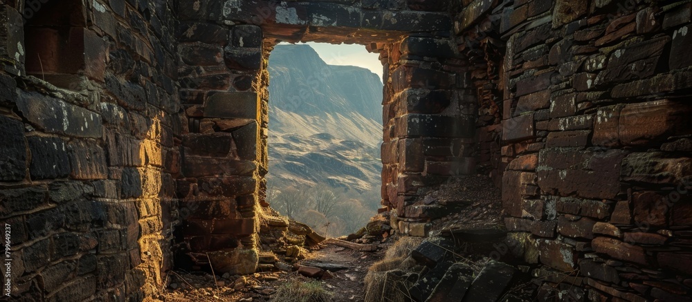 Poster scenic view of a majestic mountain through an old window of a rustic stone building