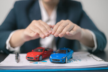 Car insurance concept. Agent negotiated a comprehensive insurance agreement for the auto business,...