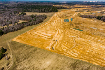 Top view of the edge of an active sand quarry, extraction of construction sand